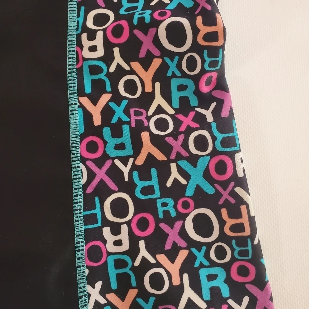 K1015 * Roxy Girls Short Sleeve Rash Guard Black Teal Size Unknown